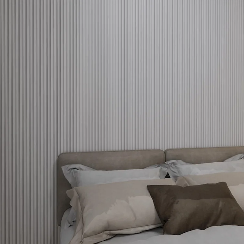 Nowoczesny projekt sypialni z teksturowanymi ścianami i wygodnym łóżkiem